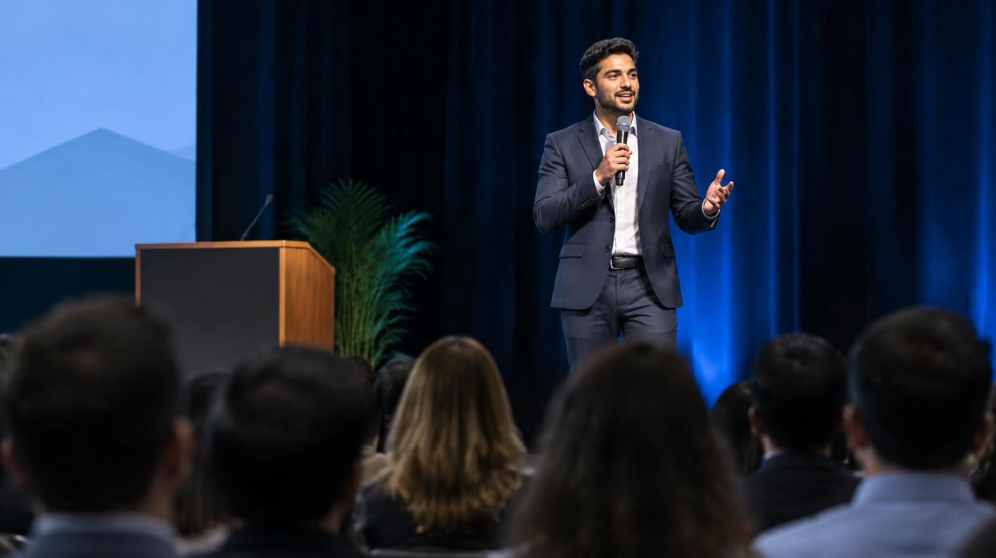 person giving speech on stage