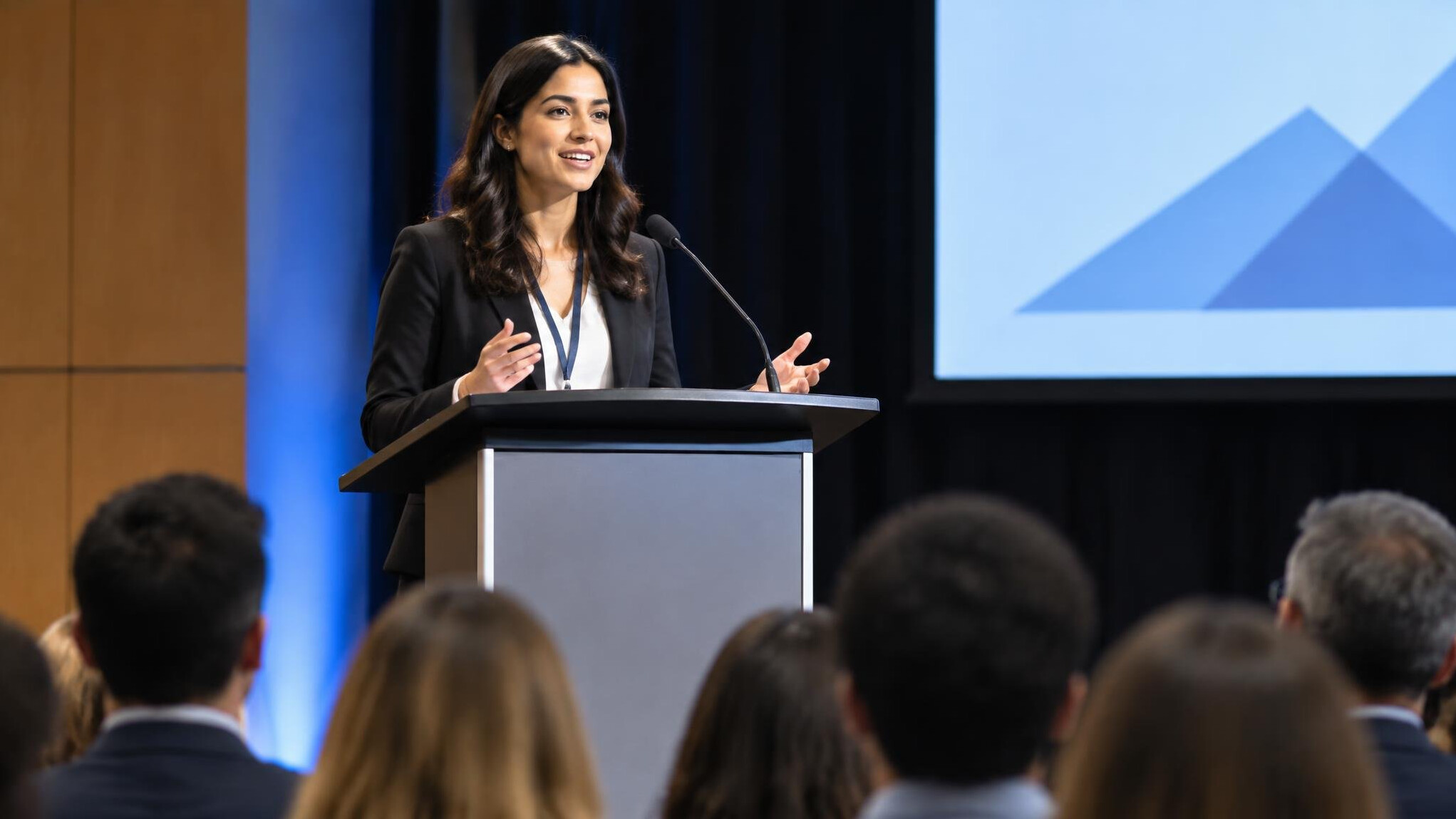 woman speaking confidently on stage