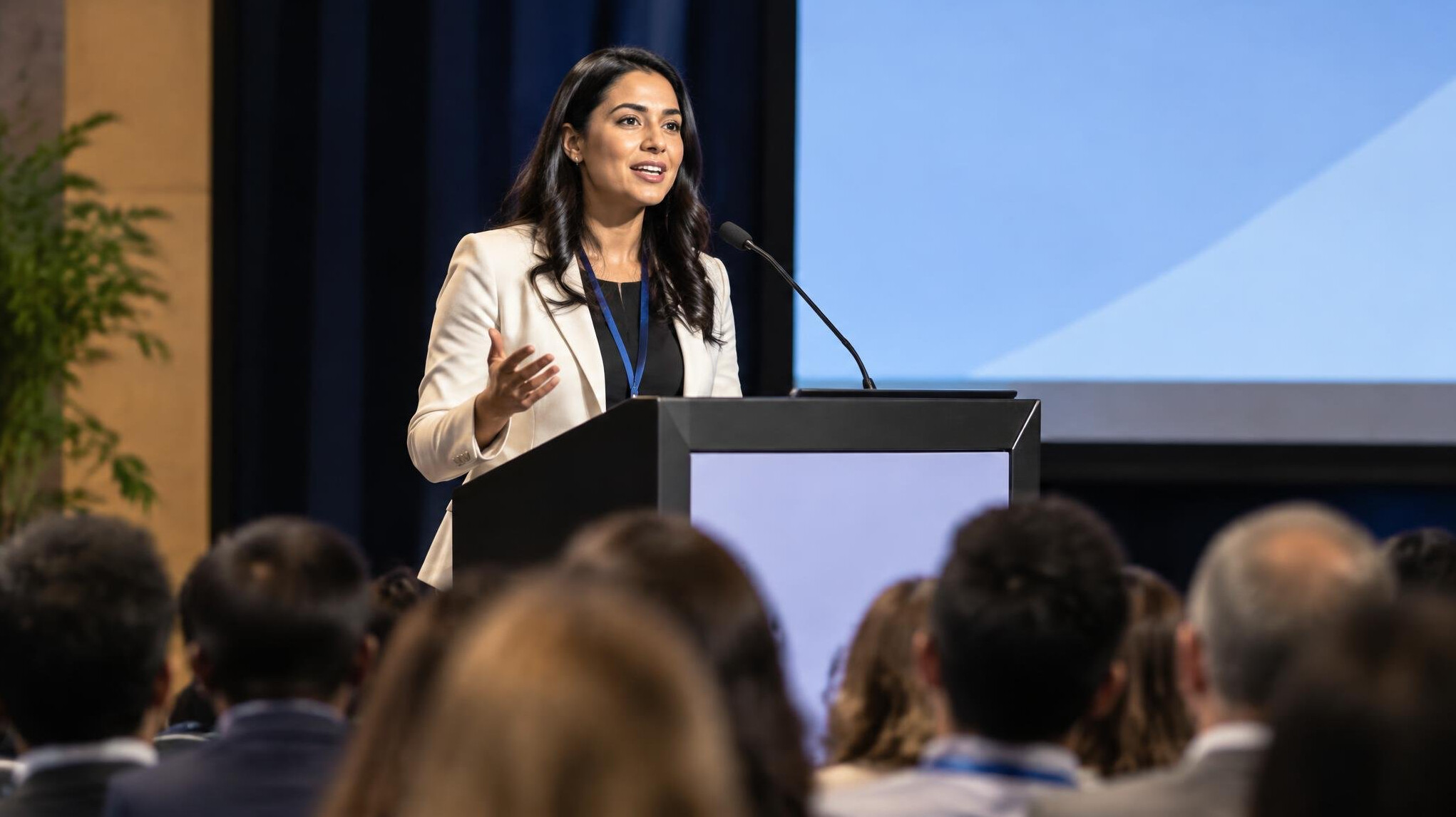 woman speaking confidently on stage